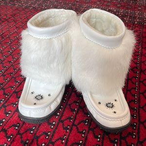 Women’s Boots: white leather and rabbit fur boots.